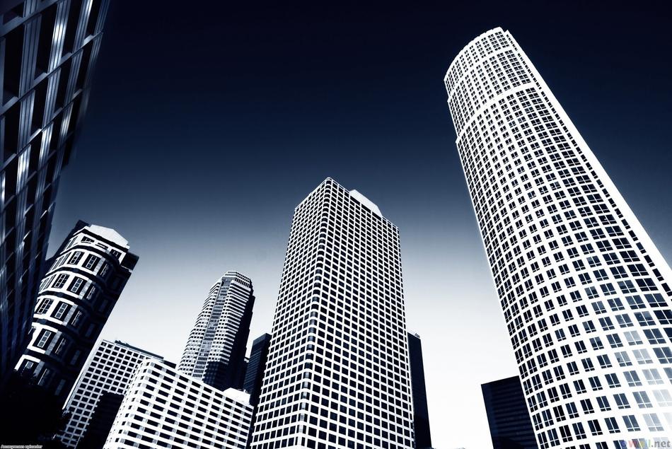 Shiny buildings, under the blue and white, gradient sky