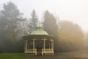 gazebo yellow in the fog