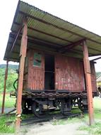 red house with pillars