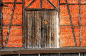 wooden doors on a brick building