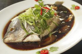 Boiled fish in sauce and vegetables