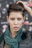 girl with stylish hairstyle holding her head