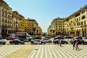 People and cars on the beautiful Aristotelous Square in Thessaloniki, Greece