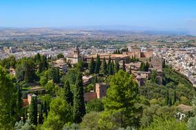 Beautiful landscape with Alhambra in Granada, Spain, with the colorful houses and green plants