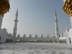 white towers of the mosque in abu dhabi