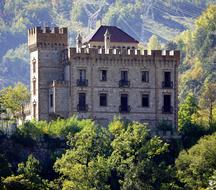 medieval castle among the trees on a sunny day