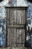 old white door of an abandoned barn