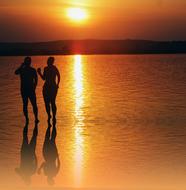 A cute couple at sunset in the bright sunshine