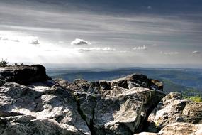 big rocks against the clouds