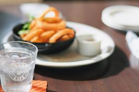 glass of water near food