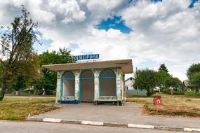 bus stop with blue lettering
