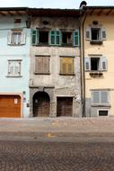 facade of an old house with dilapidated windows