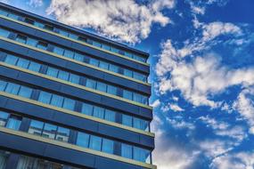 blue sky reflected in the glass facade