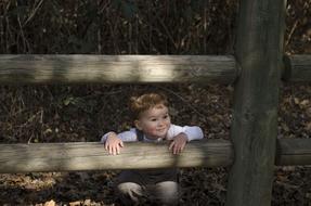 Boy Cute wood fence