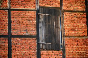 building red brick wall and wood door