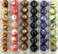 colored round chocolates in a box