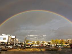 Rainbow on dark Clouds Sky