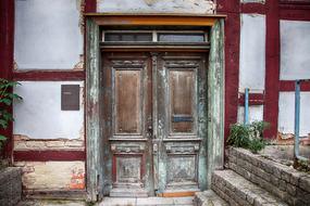 Beautiful old oak door of the white and red house