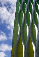 contemporary facade covered with tile at cloudy sky