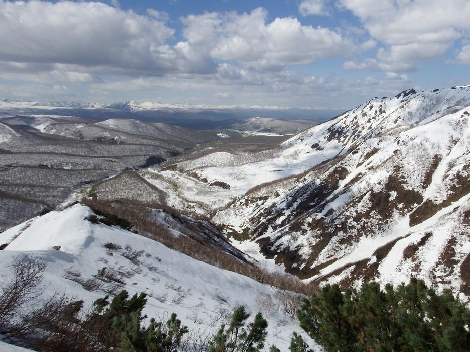 snowy mountain with clouds