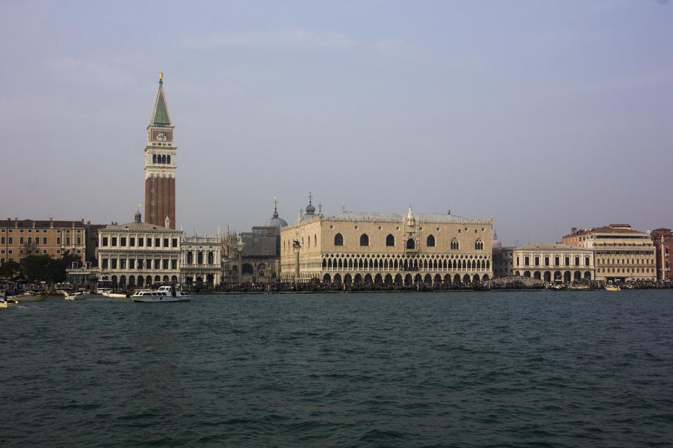 Beautiful shore of Venice, with the buildings near the blue water, in Italy