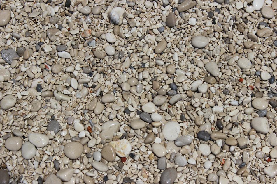 small and large pebbles on the coast