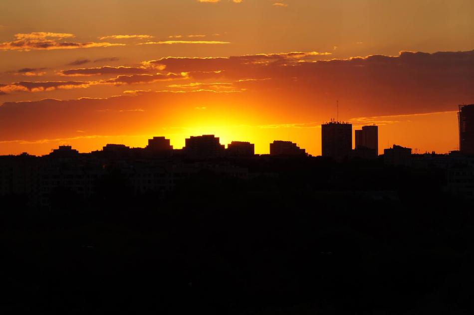 Silhouette of Warsaw, Poland, at colorful and beautiful sunset on horizon