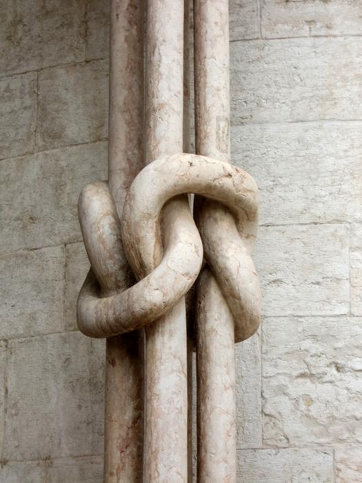 photo of a pillar with a decorative knot