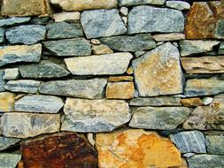 Close-up of the wall, made of the colorful and beautiful stones