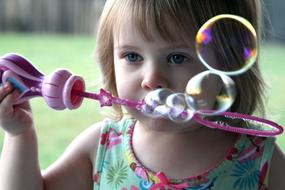 Child blow soap Bubbles