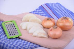 peeled onions on a board