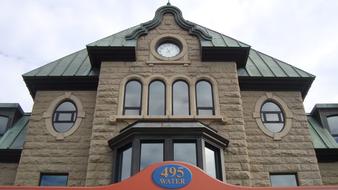 facade of a brick building with a clock