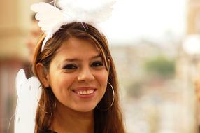 happy young girl with white headdress
