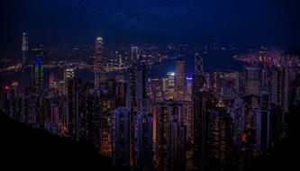 panoramic view of gong kong skyscrapers at night