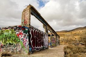 graffiti on an abandoned factory in the desert