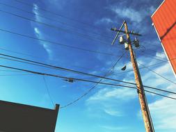 city power lines on blue sky background