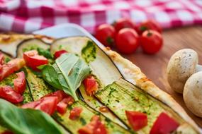 pizza with tomatoes, eggplant and herbs