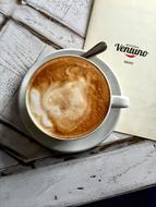 frothy hot drink in a cup