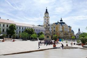 People, near the beautiful and colorful Five Churches, among the plants in PÃ©cs, Czech Republic