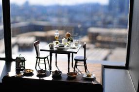 ute miniature of a table by the window