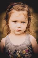 Portrait of the cute baby kid, at blurred background