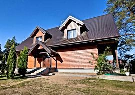 photo of a wooden house by the lake