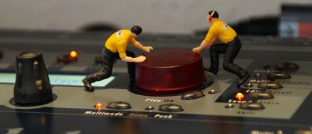 plastic figures on the DJ panel