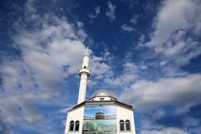 photo of a mosque against the blue cloudy sky in Albania