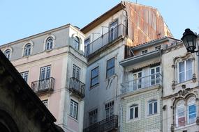 facades of houses with windows in Coimbra