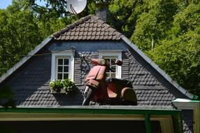 old motorcycle on the roof of the house