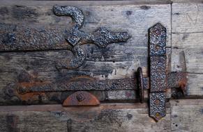 Beautiful old wooden door with the metal latch