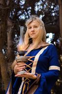 girl with a goblet of fire in her hands