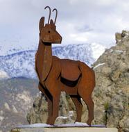 Statue Iron goat on a blurred background