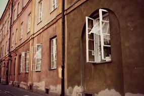 old building with open white windows